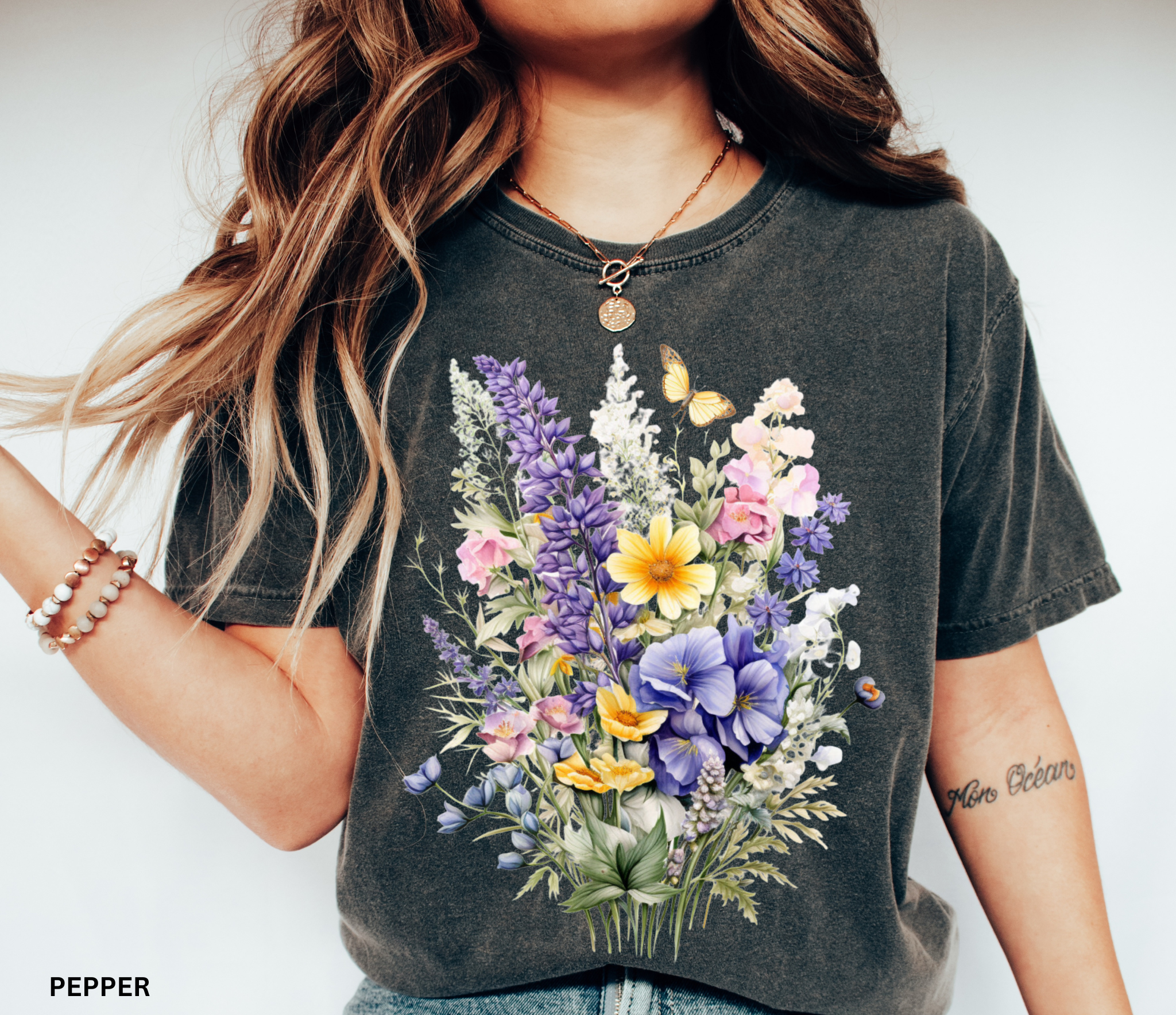 Cottagecore floral shirt design featuring watercolor-style wildflowers and a butterfly, soft botanical vintage aesthetic