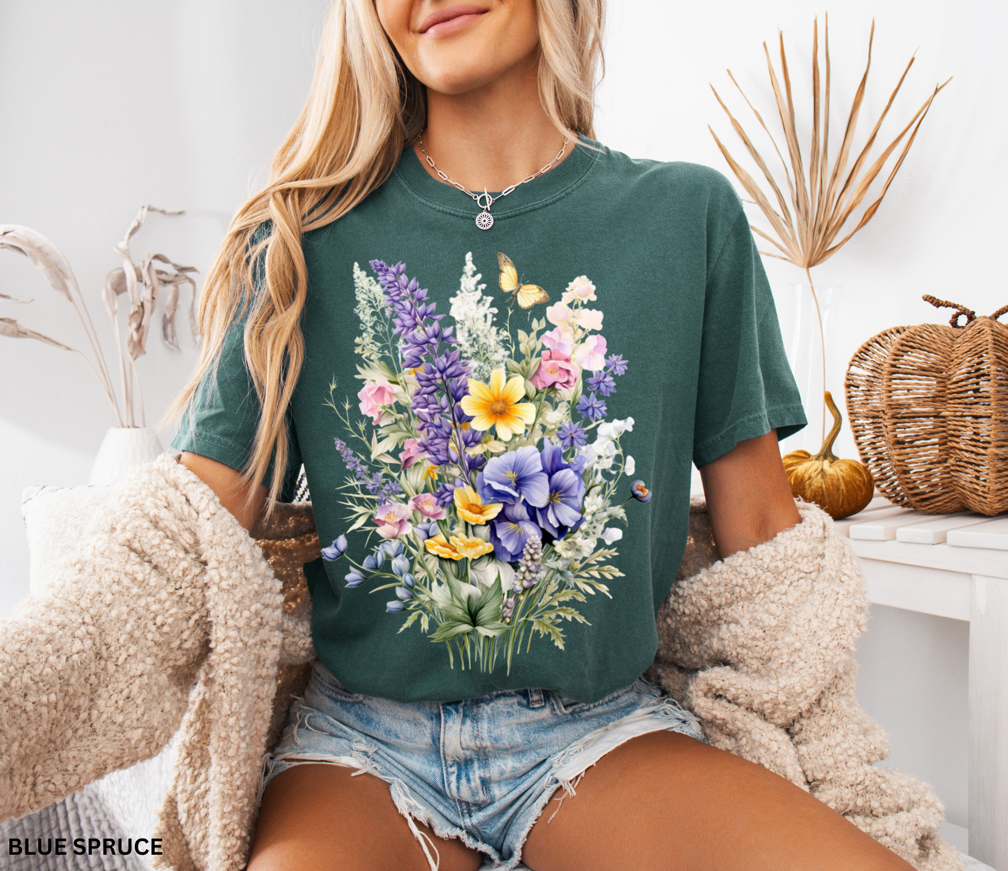 Cottagecore floral shirt design featuring watercolor-style wildflowers and a butterfly, soft botanical vintage aesthetic