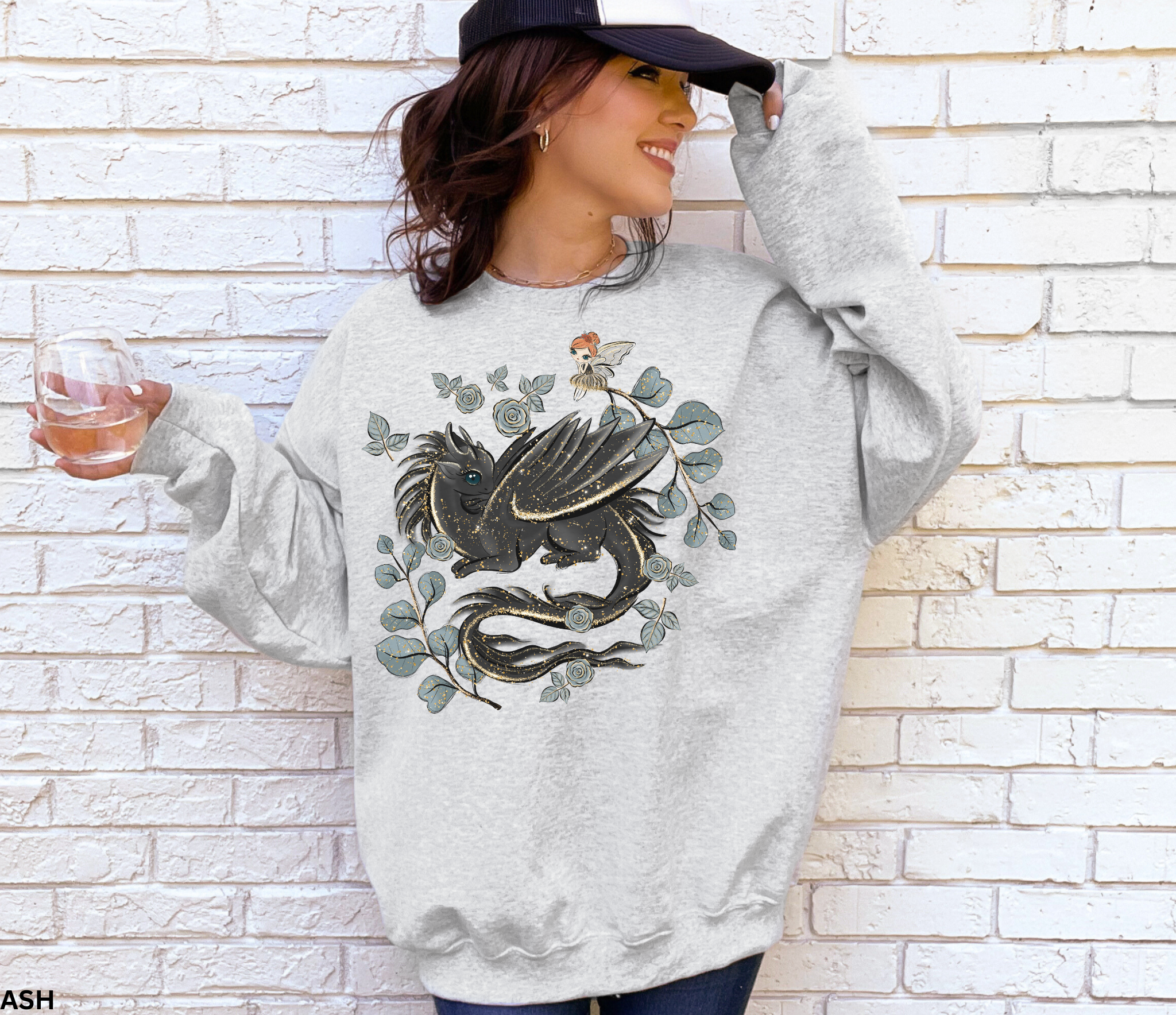 Close-up of dragon and fairy cottagecore design printed on a soft sweatshirt.