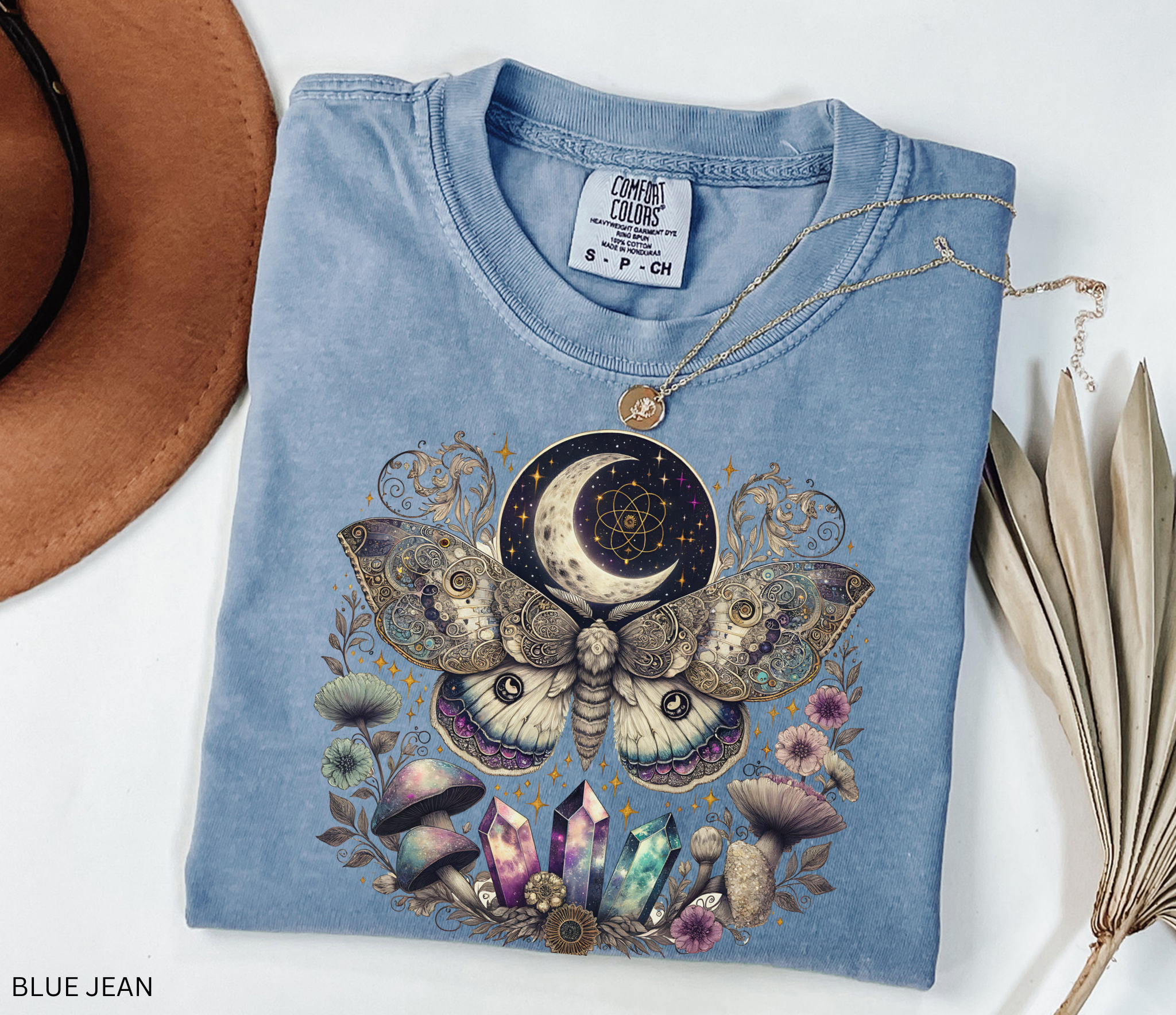 Intricate celestial luna moth illustration surrounded by crystals, mushrooms, flowers, stars, and crescent moon in a mystical fantasy style.