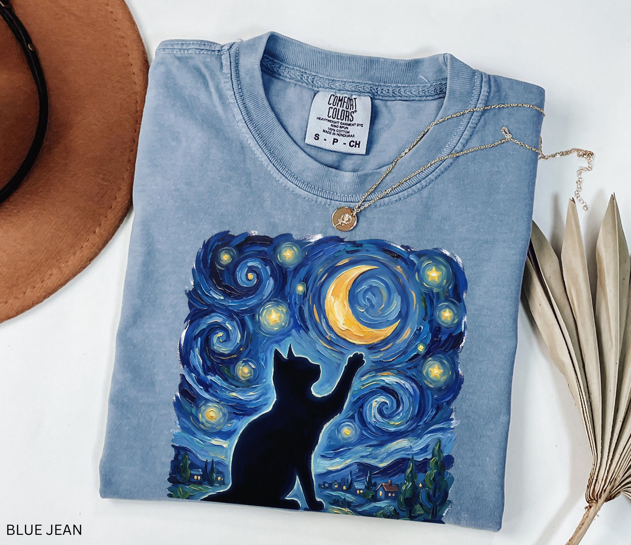 Whimsical black cat illustration reaching toward a glowing crescent moon beneath a swirling blue starry night sky. Celestial cottagecore artwork featuring stars, moonlight, and magical cat aesthetic.