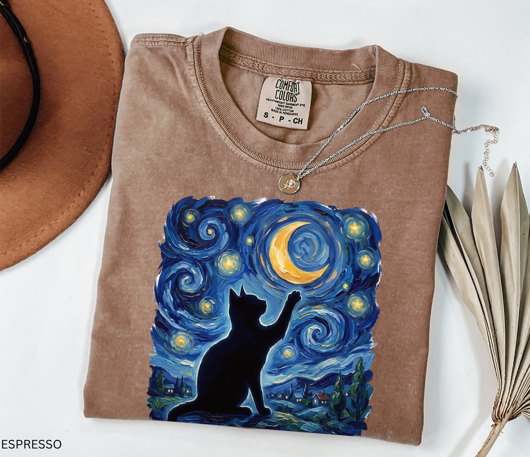 Whimsical black cat illustration reaching toward a glowing crescent moon beneath a swirling blue starry night sky. Celestial cottagecore artwork featuring stars, moonlight, and magical cat aesthetic.