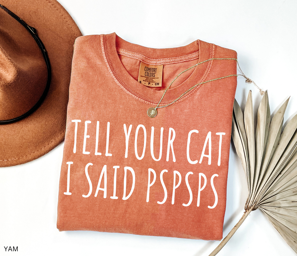 Funny black and white cat lover shirt with the phrase "Tell Your Cat I Said Pspsps," perfect for cat moms, cat dads, pet lovers, and anyone who can't resist greeting every cat they see.