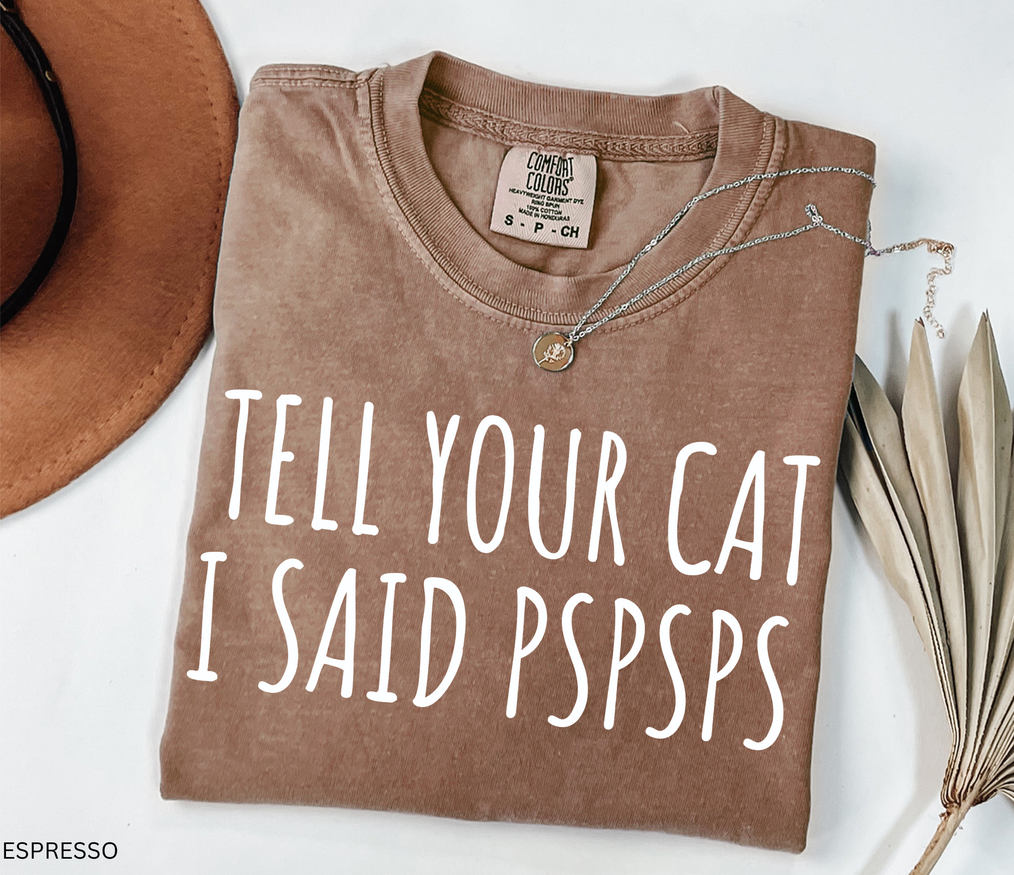 Funny black and white cat lover shirt with the phrase "Tell Your Cat I Said Pspsps," perfect for cat moms, cat dads, pet lovers, and anyone who can't resist greeting every cat they see.
