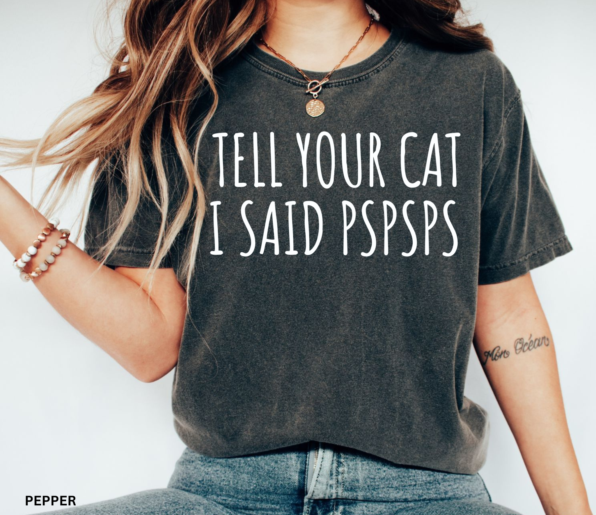Funny black and white cat lover shirt with the phrase "Tell Your Cat I Said Pspsps," perfect for cat moms, cat dads, pet lovers, and anyone who can't resist greeting every cat they see.