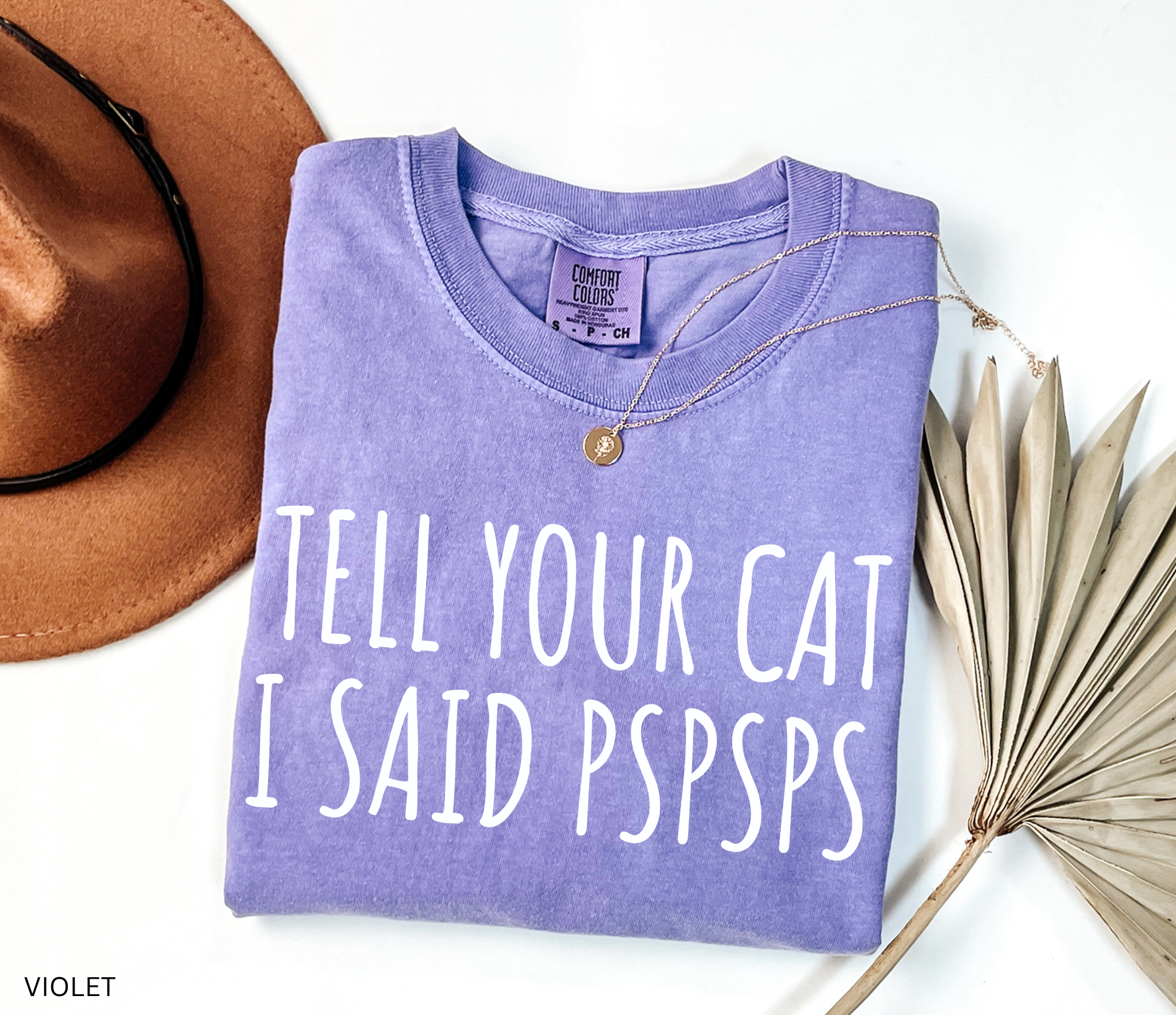Funny black and white cat lover shirt with the phrase "Tell Your Cat I Said Pspsps," perfect for cat moms, cat dads, pet lovers, and anyone who can't resist greeting every cat they see.