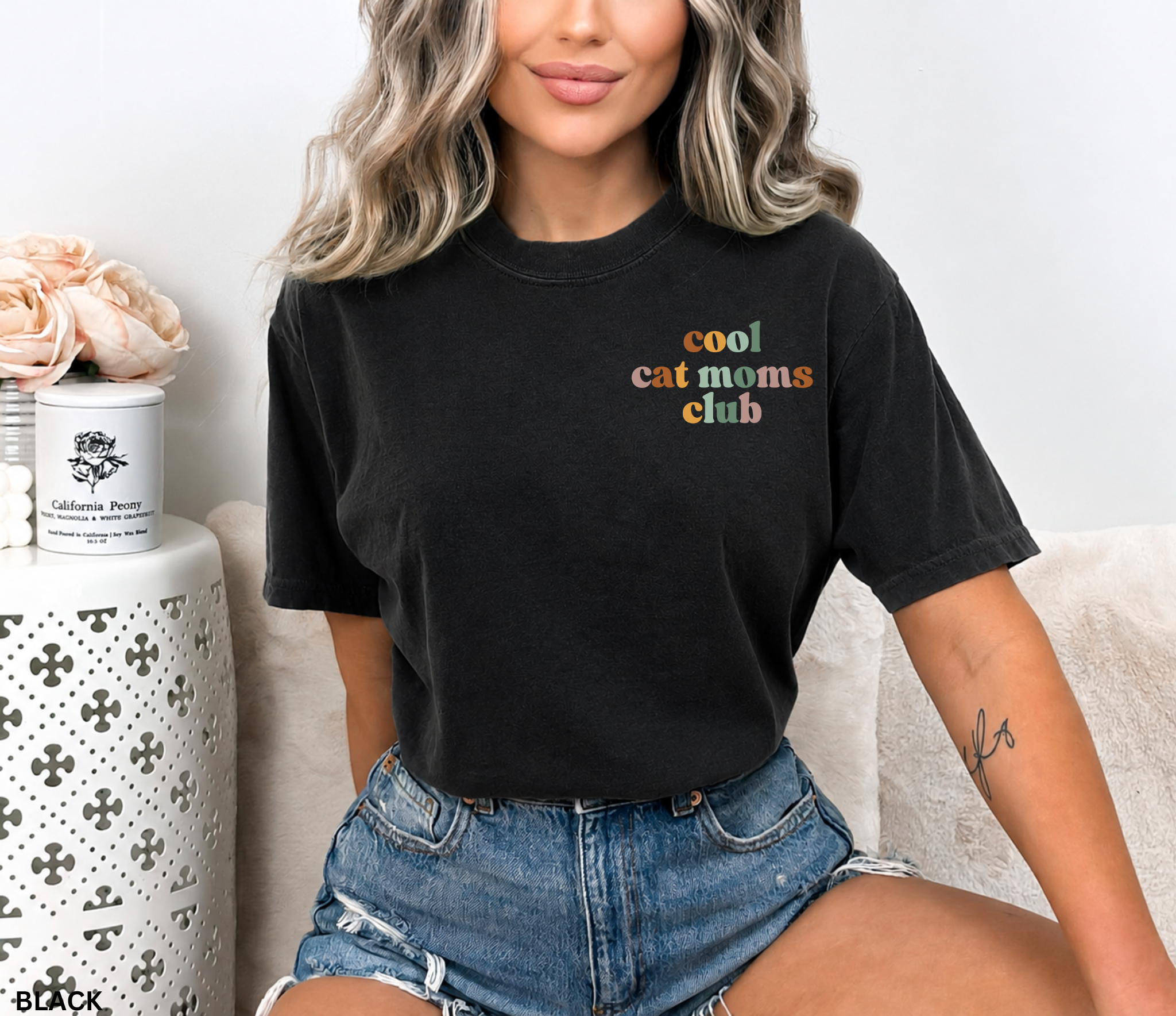 Cute "Cool Cat Moms Club" retro typography graphic t-shirt featuring pastel lettering for cat moms and cat lovers.