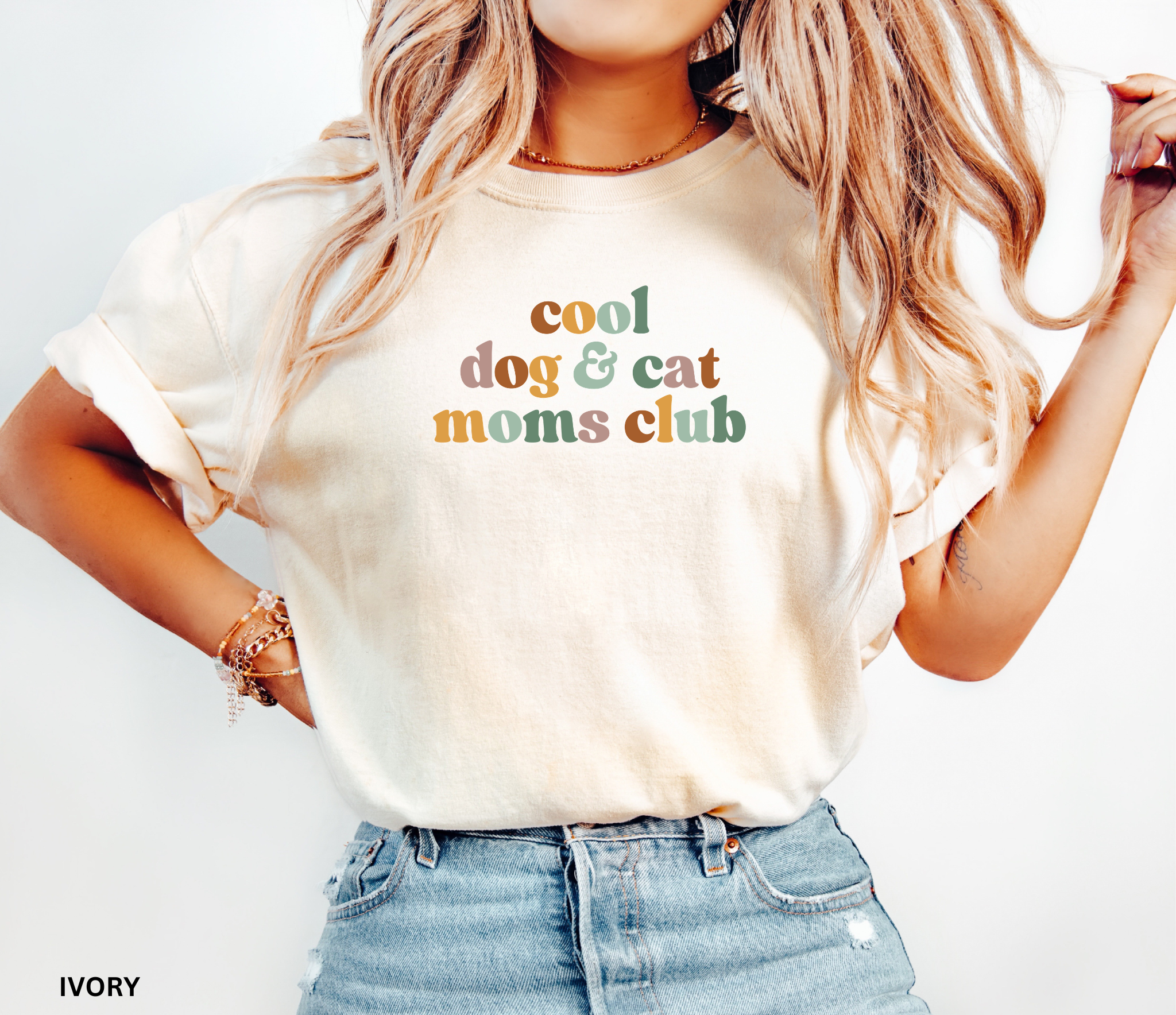 Retro "Cool Dog & Cat Moms Club" graphic t-shirt featuring colorful vintage lettering for dog moms, cat moms, and proud pet lovers.