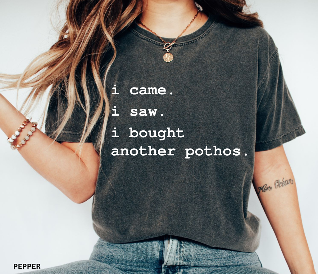 Comfort Colors plant lover t-shirt featuring the funny quote "I Came. I Saw. I Bought Another Pothos." for houseplant lovers and indoor gardeners.