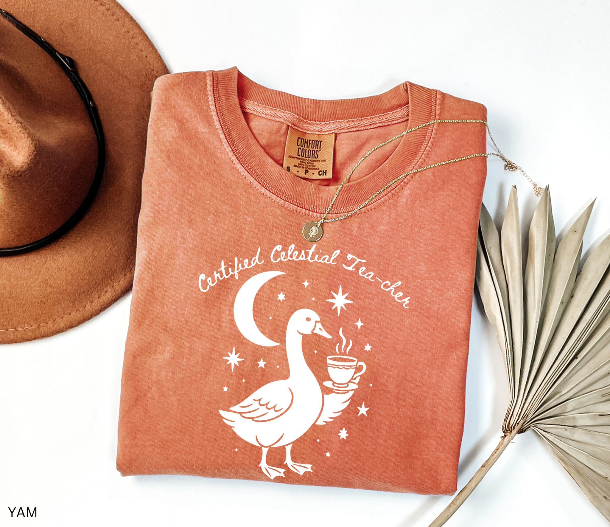 Certified Celestial Tea-cher Comfort Colors t-shirt featuring a whimsical goose holding a steaming teacup beneath a crescent moon and stars, perfect for witchy teachers, tea lovers, and cottagecore fashion.
