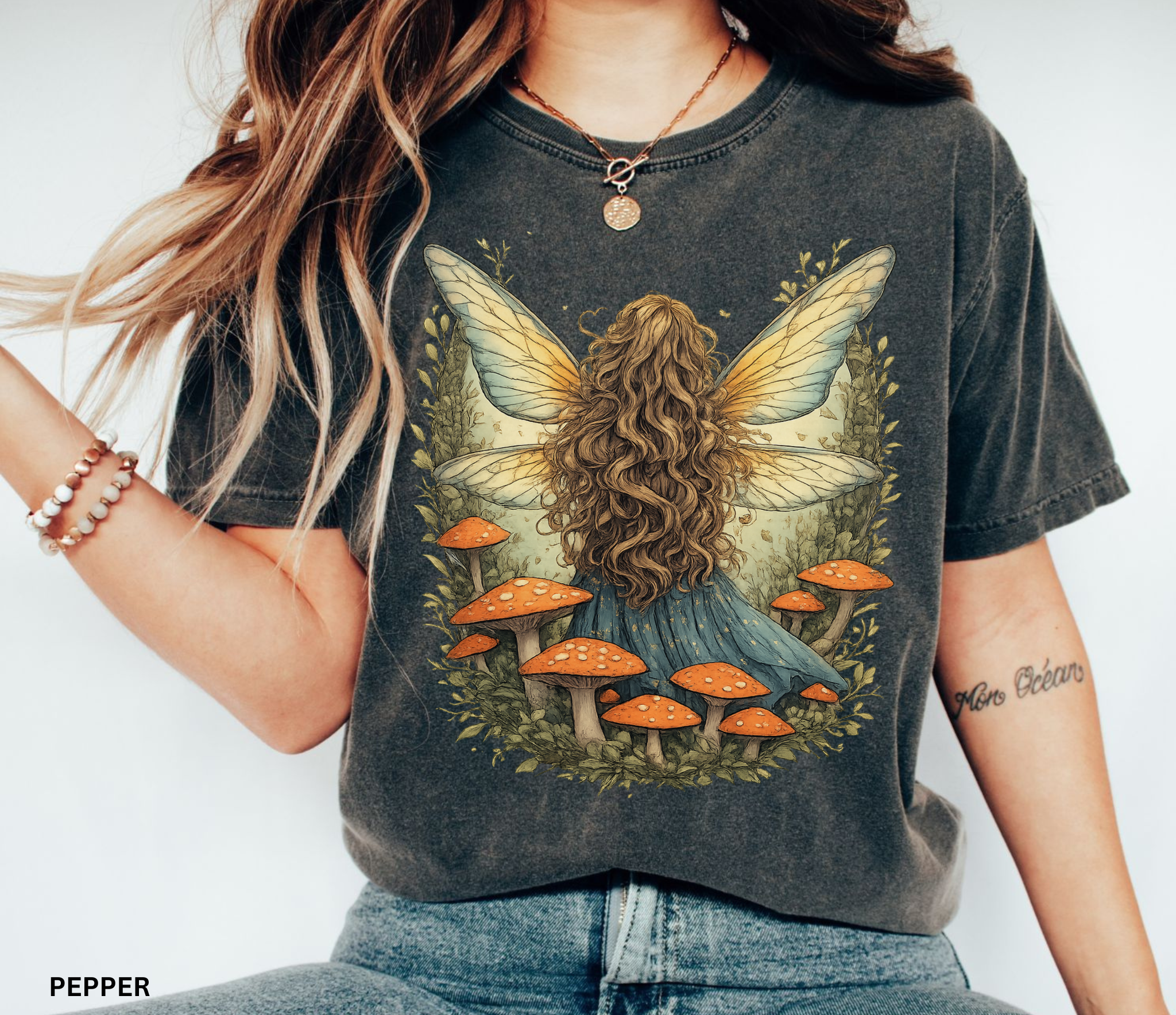 Whimsical fairy girl with glowing wings surrounded by orange mushrooms in an enchanted forest, cottagecore fairycore aesthetic shirt design.