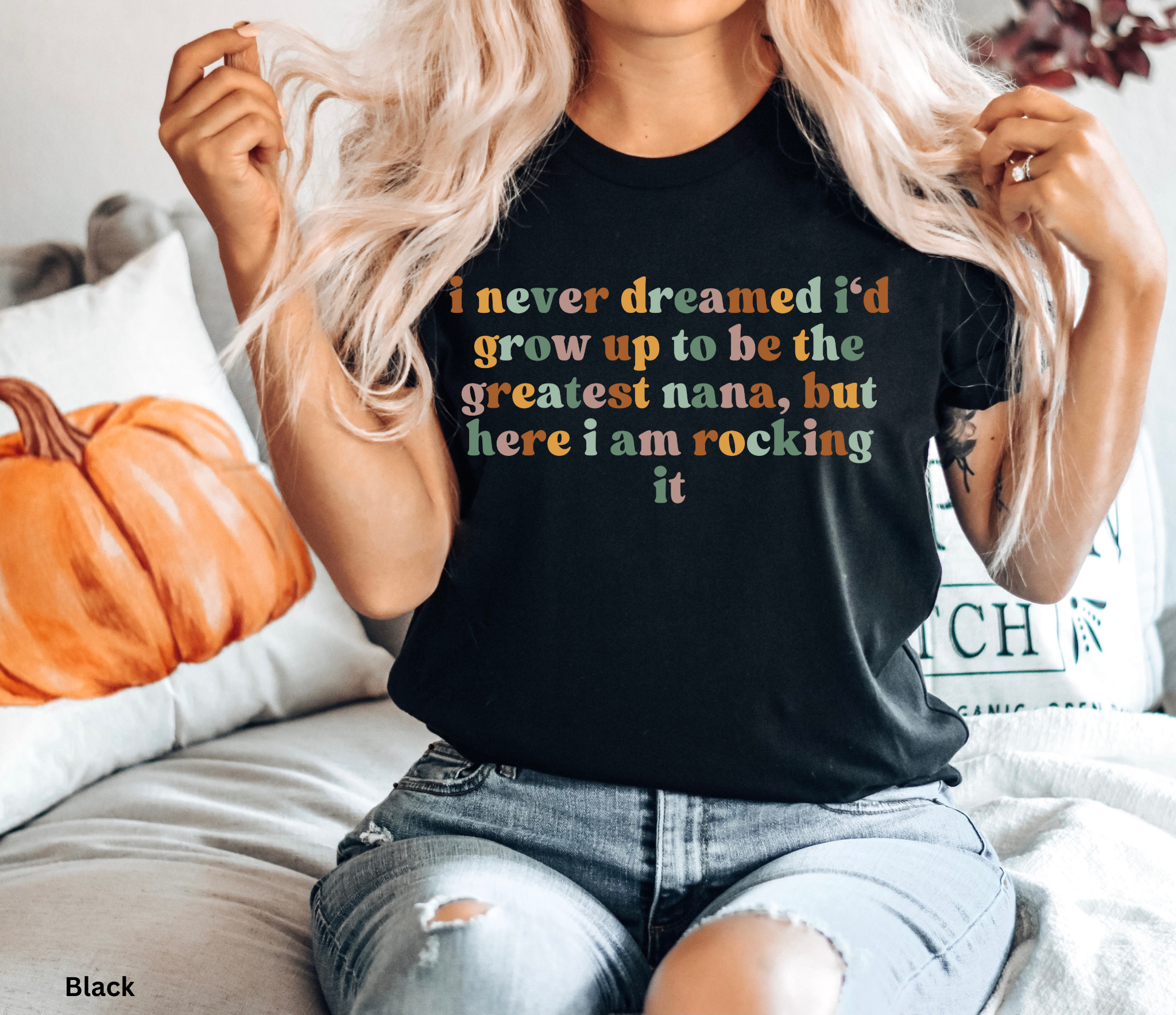 Retro-style text reading “I never dreamed I’d grow up to be the greatest nana, but here I am rocking it” in warm pastel colours on a black background.