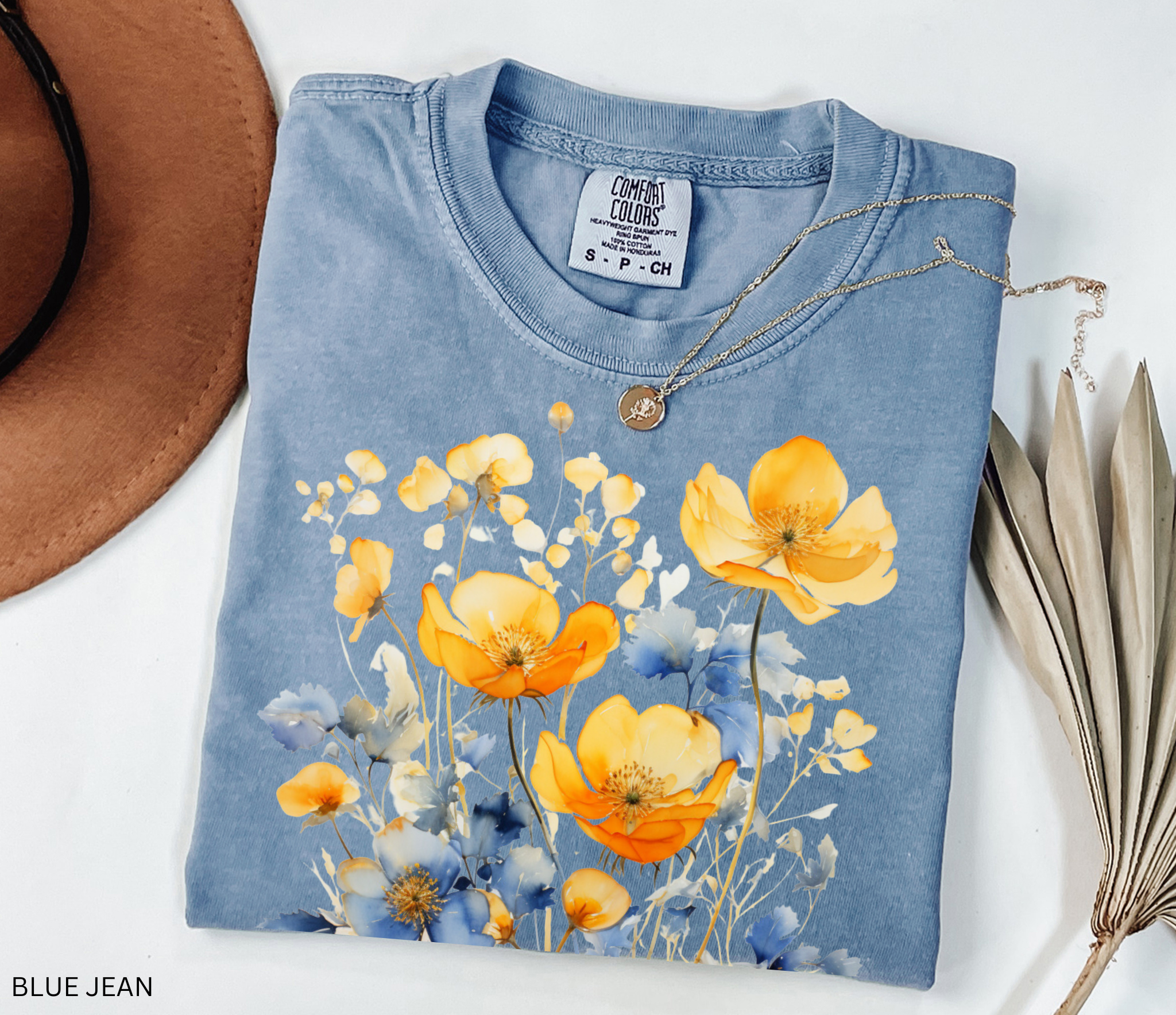 Comfort Colors Pepper t-shirt featuring a Nordic wildflower botanical design with earthy orange, yellow, and charcoal florals in a cottagecore style