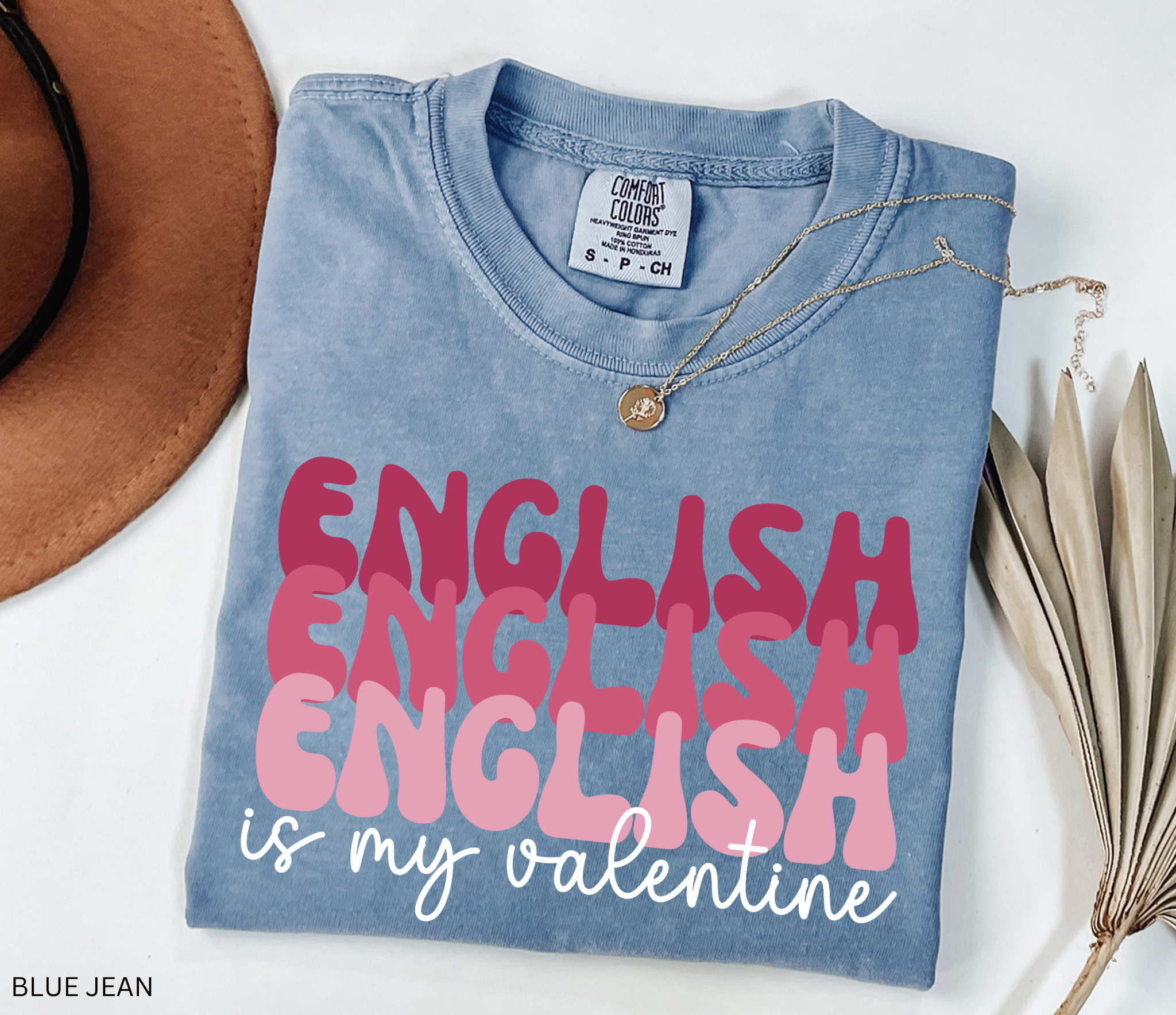 English Is My Valentine text design in layered pink lettering on a black background, created as a playful Valentine’s Day shirt for English teachers and book lovers.