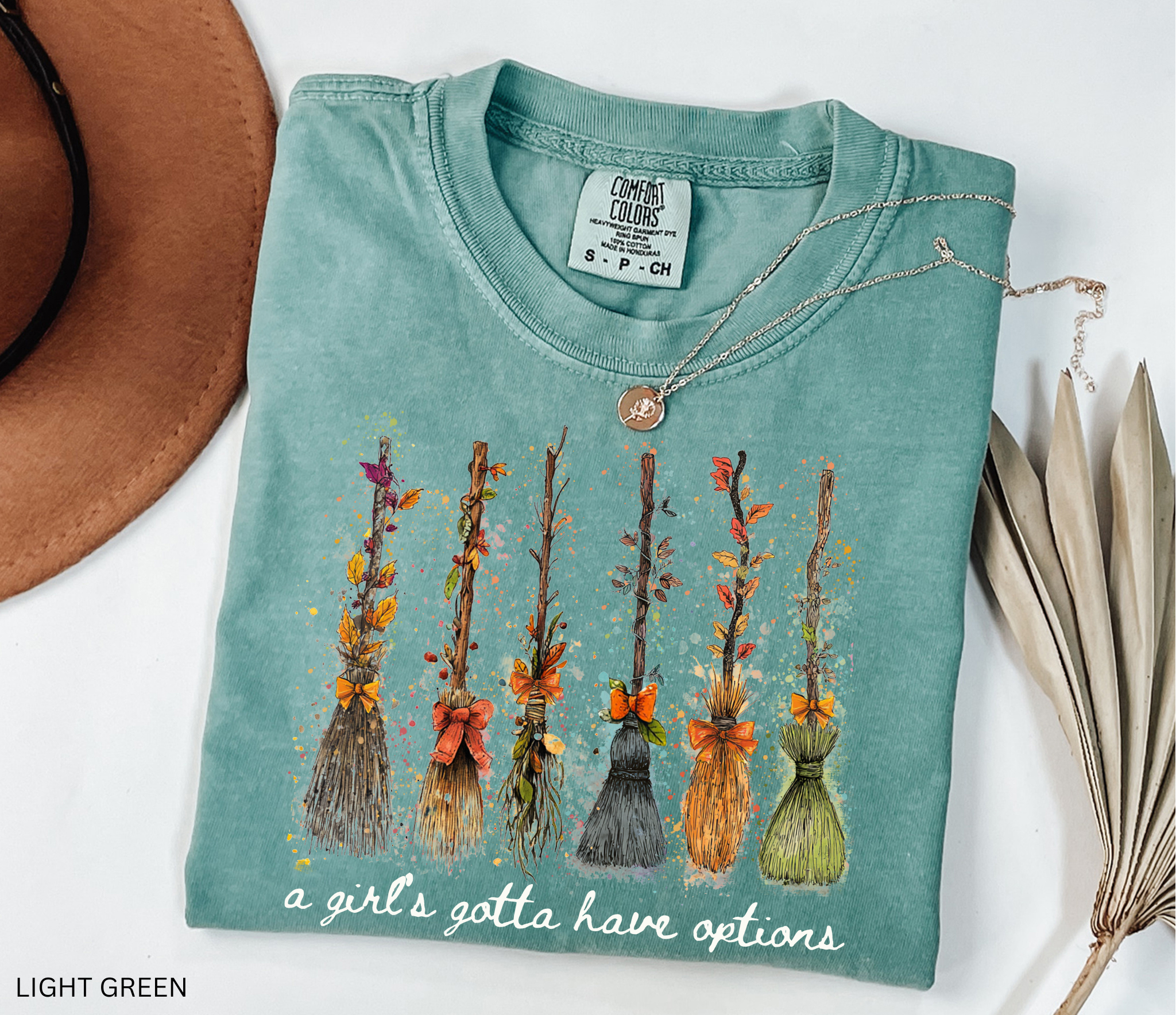 Funny Halloween witch broom shirt with quote A Girl’s Gotta Have Options