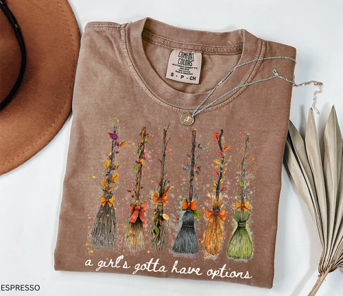 Funny Halloween witch broom shirt with quote A Girl’s Gotta Have Options