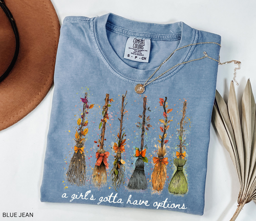 Funny Halloween witch broom shirt with quote A Girl’s Gotta Have Options