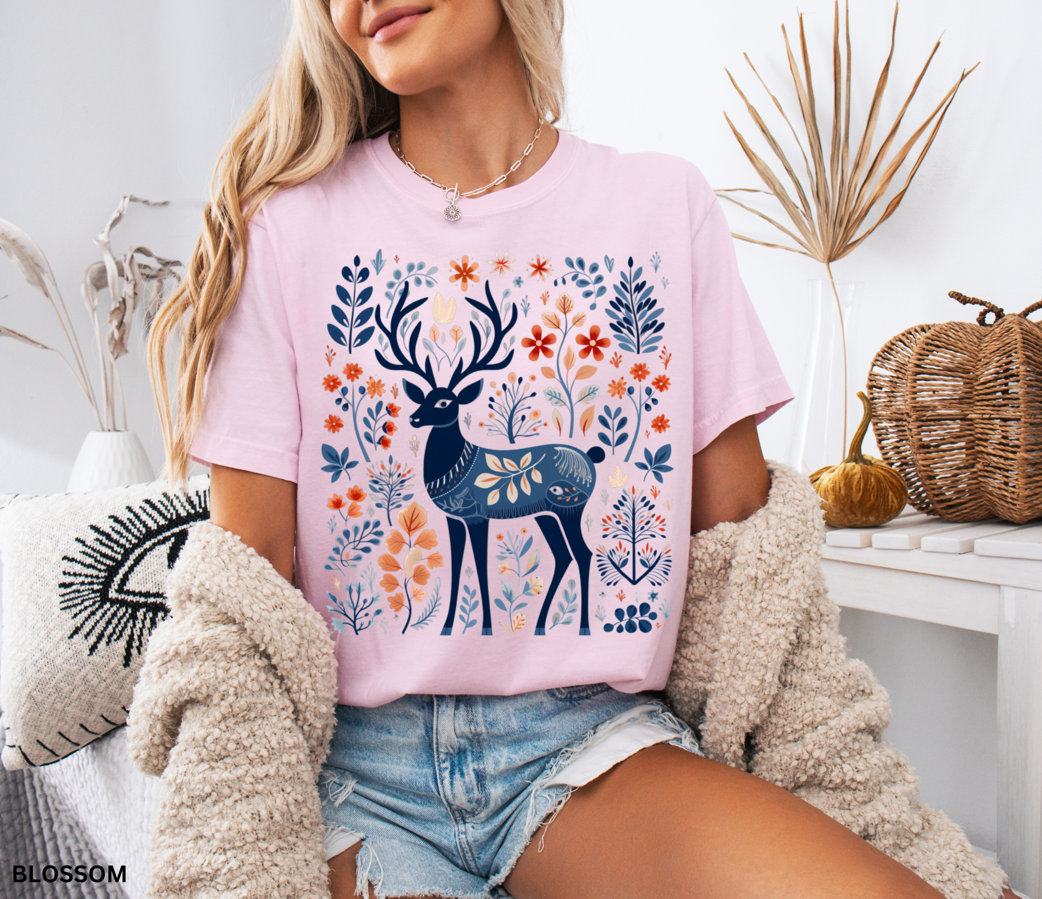 Nordic folk art deer surrounded by woodland leaves and flowers on a cottagecore forest shirt