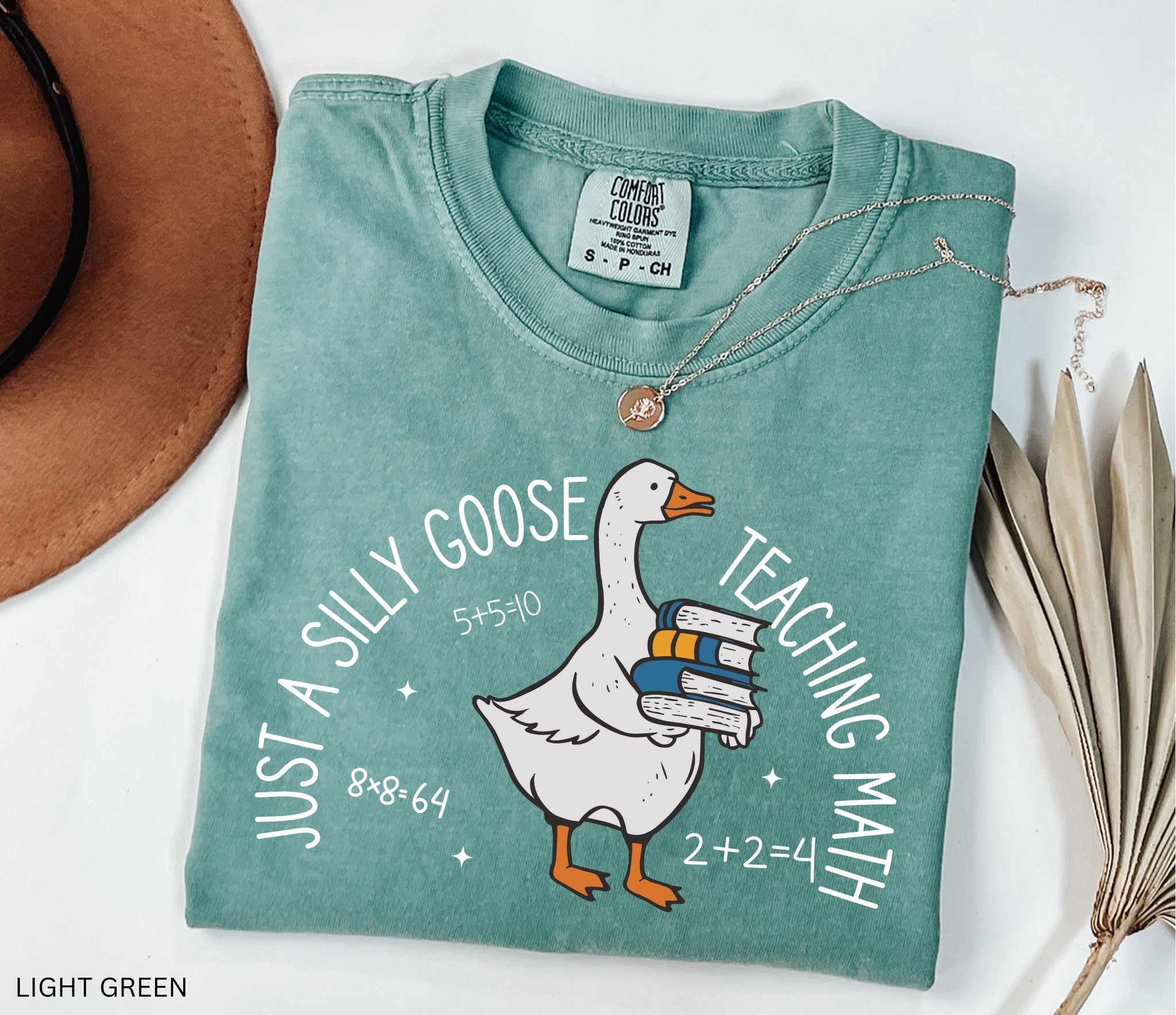 Funny math teacher shirt with a goose holding books, perfect teacher gift or classroom tee