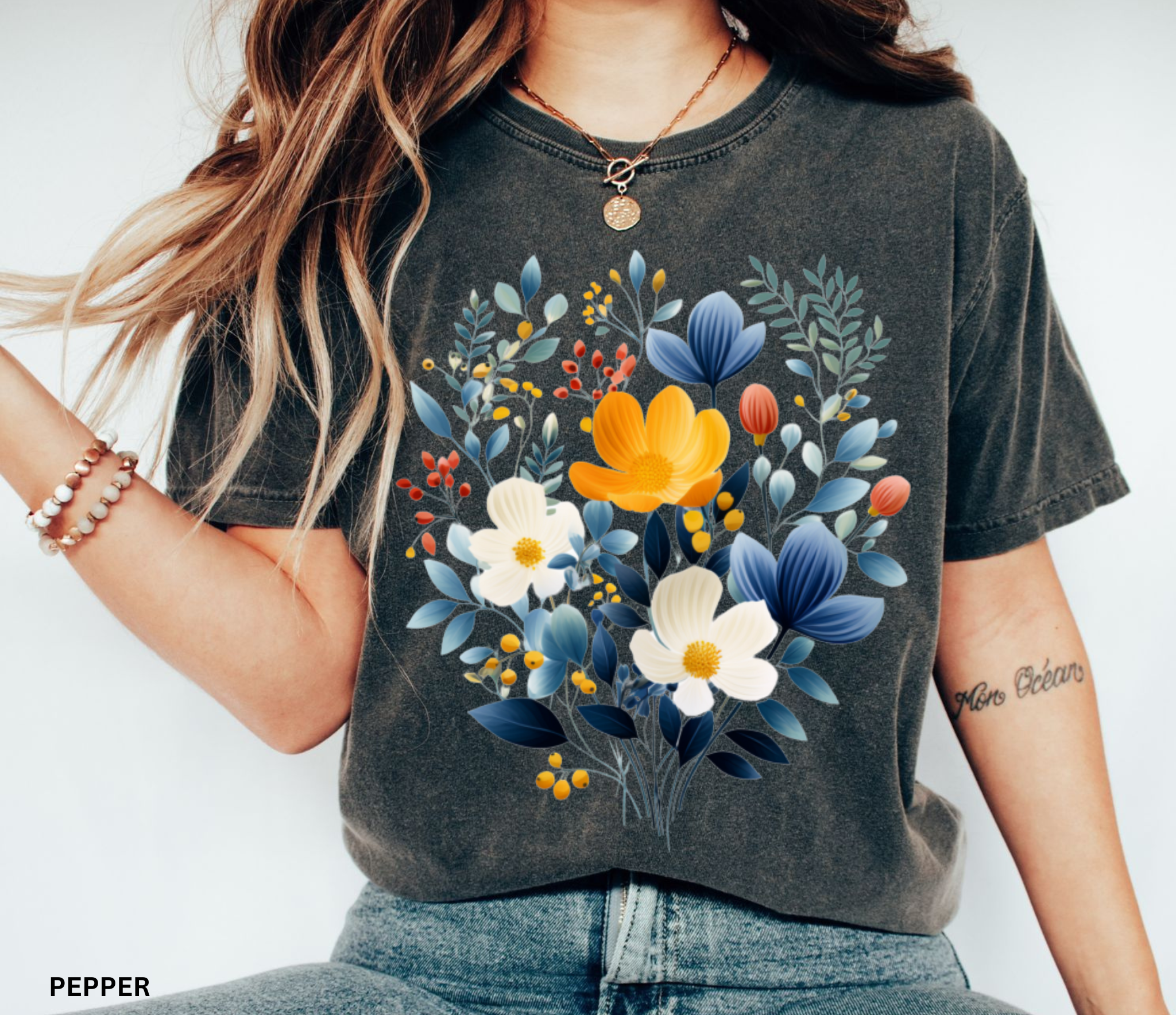 Nordic folk wildflower bouquet with blue, ivory, and yellow flowers on a cottagecore floral shirt