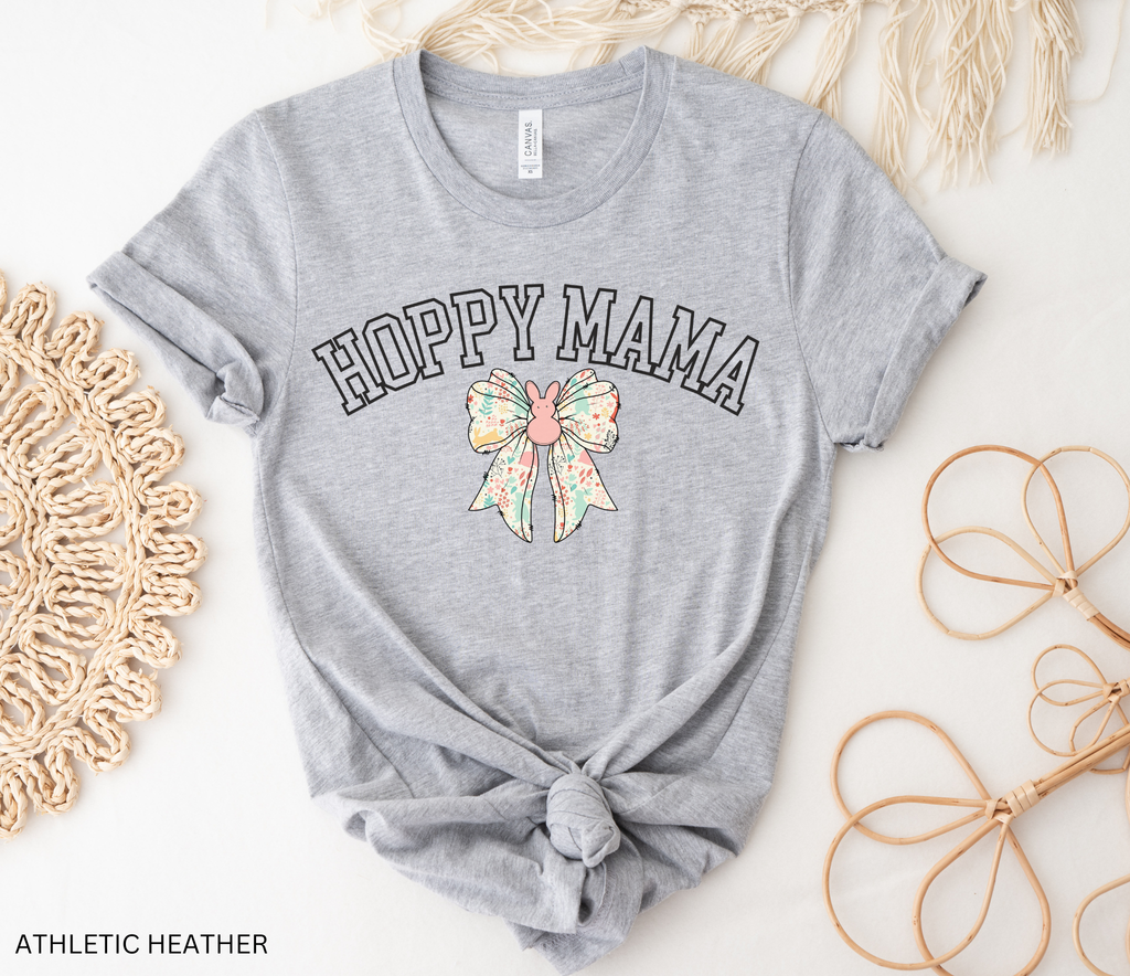 Hoppy Mama Easter shirt with pastel floral bunny bow design on a black background