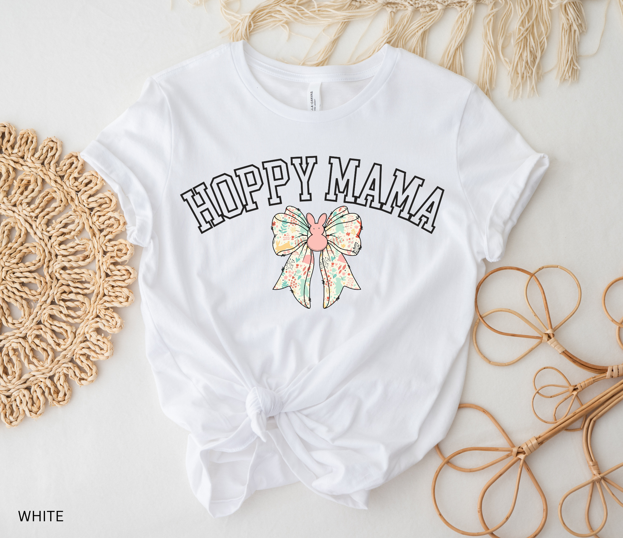 Hoppy Mama Easter shirt with pastel floral bunny bow design on a black background
