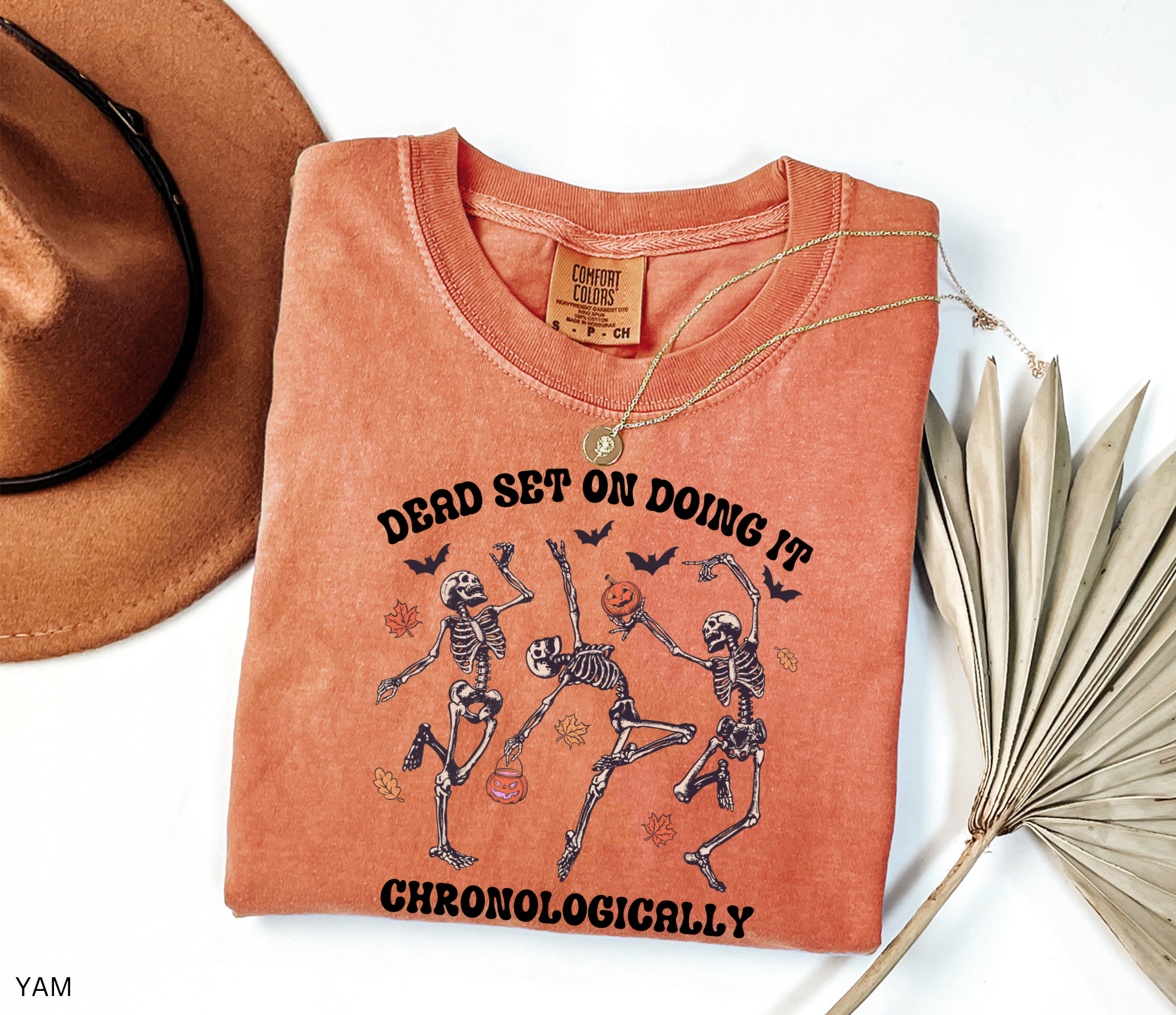History teacher Halloween shirt with dancing skeletons, pumpkins, bats, and autumn leaves. Funny spooky season tee for teachers and classrooms.