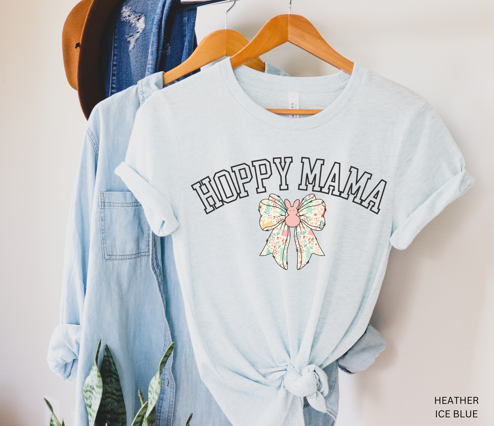 Hoppy Mama Easter shirt with pastel floral bunny bow design on a black background