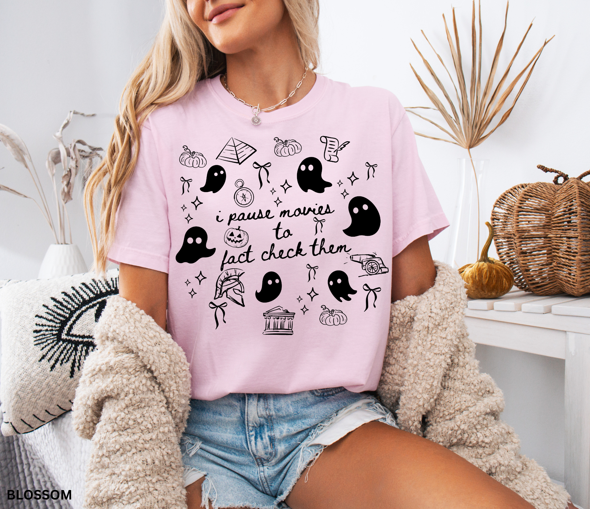 Halloween history teacher shirt with doodle-style ghosts and history-themed elements. Funny spooky season tee for teachers and classrooms.