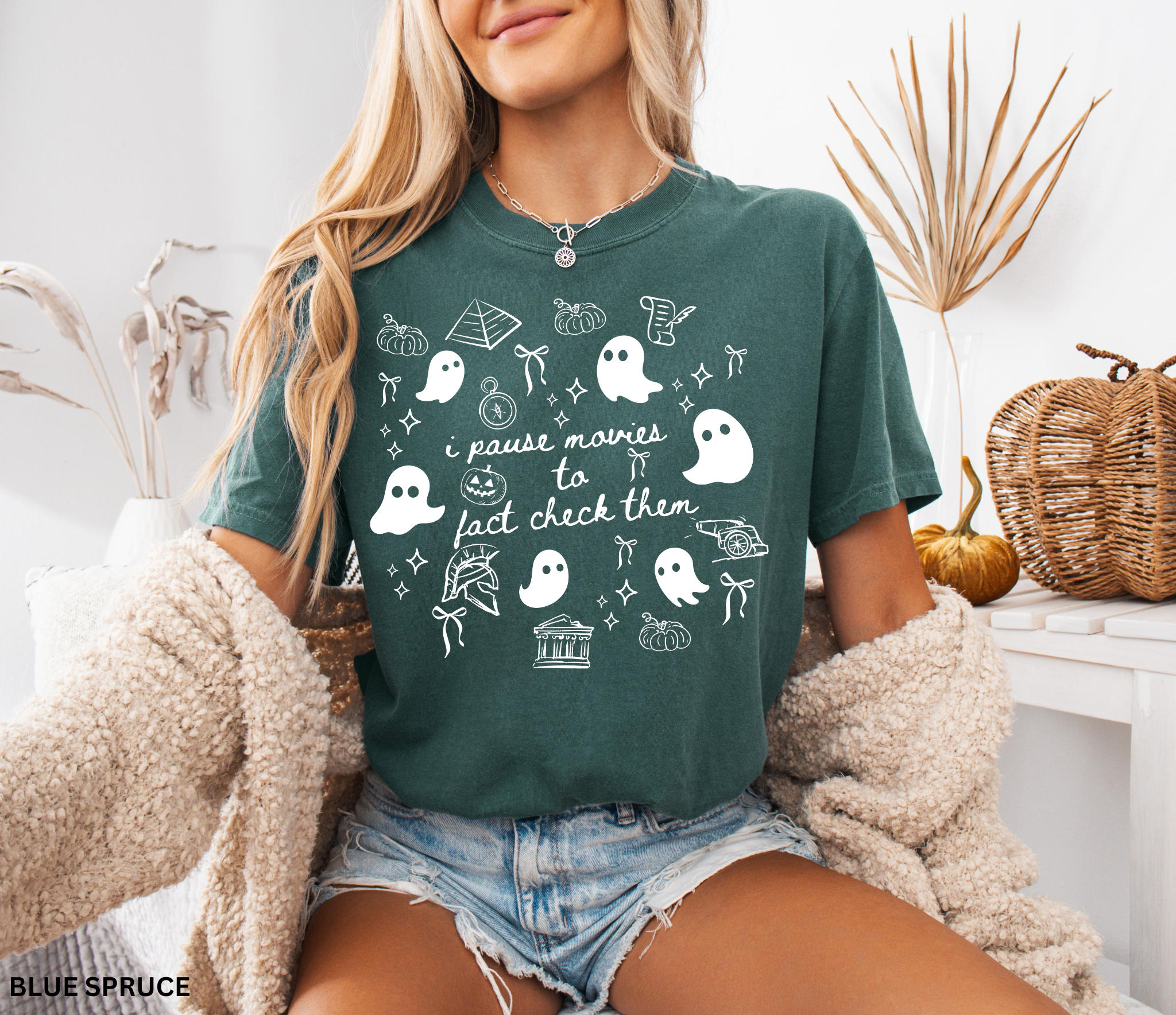 Halloween history teacher shirt with doodle-style ghosts and history-themed elements. Funny spooky season tee for teachers and classrooms.