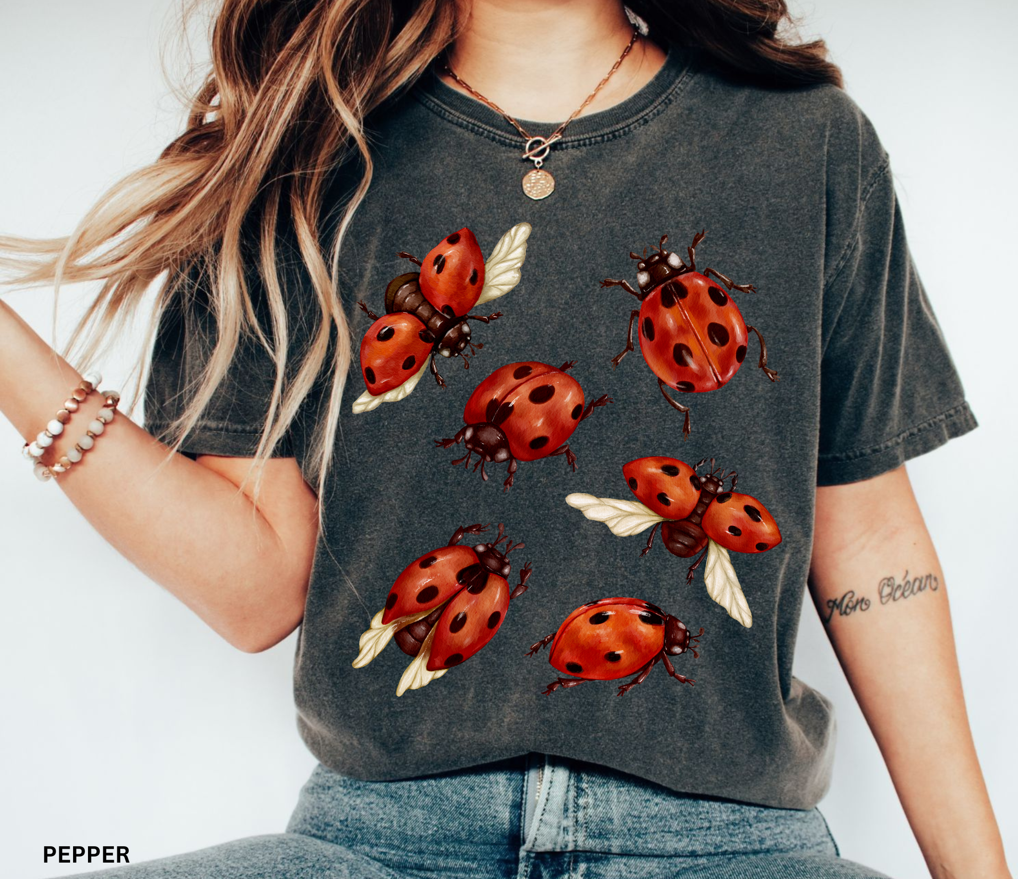 Watercolor red ladybugs design printed on a vintage-style Comfort Colors cottagecore shirt