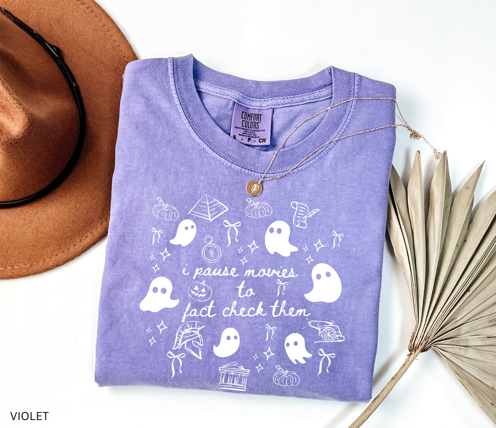 Halloween history teacher shirt with doodle-style ghosts and history-themed elements. Funny spooky season tee for teachers and classrooms.