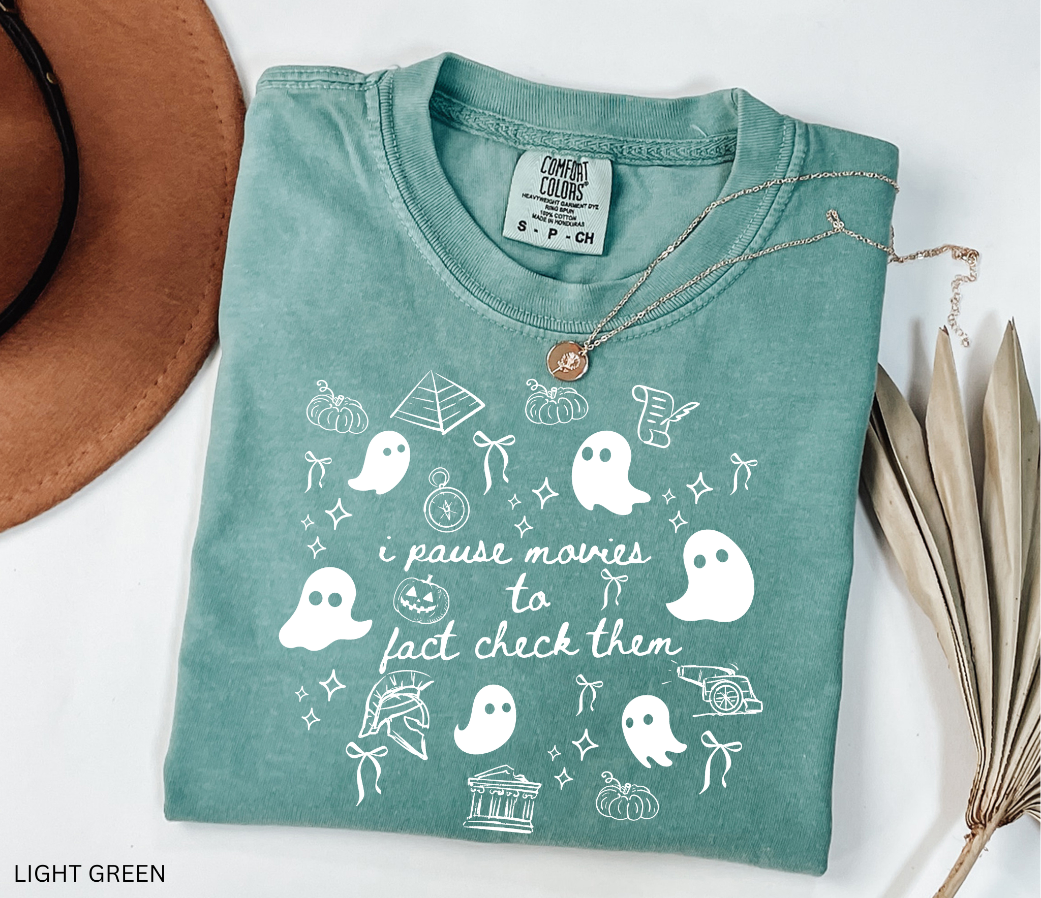 Halloween history teacher shirt with doodle-style ghosts and history-themed elements. Funny spooky season tee for teachers and classrooms.