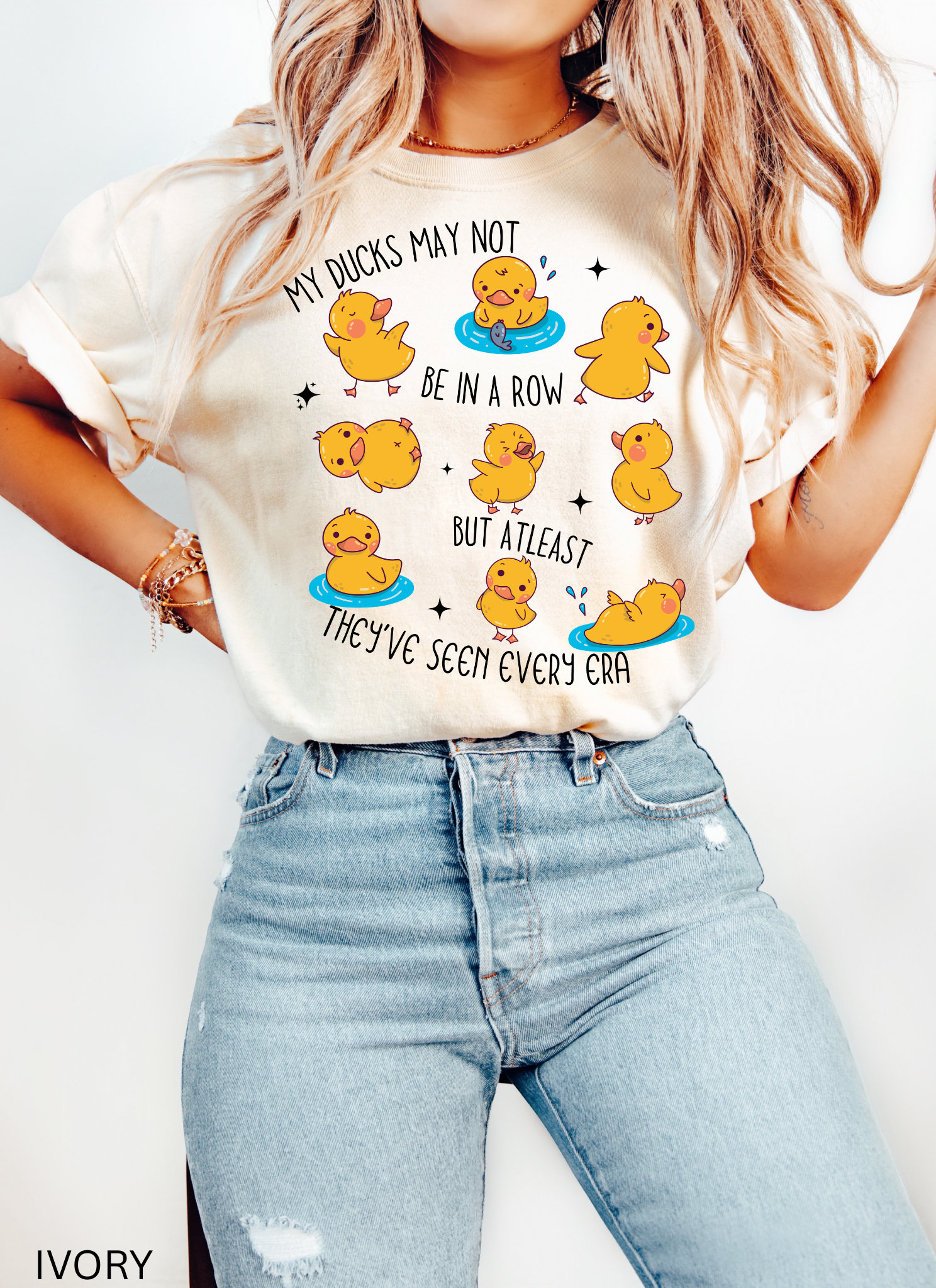 Cute history teacher shirt design with cartoon yellow ducks in different poses and the phrase “My ducks may not be in a row but at least they’ve seen every era.” Funny gift for history and social studies teachers.